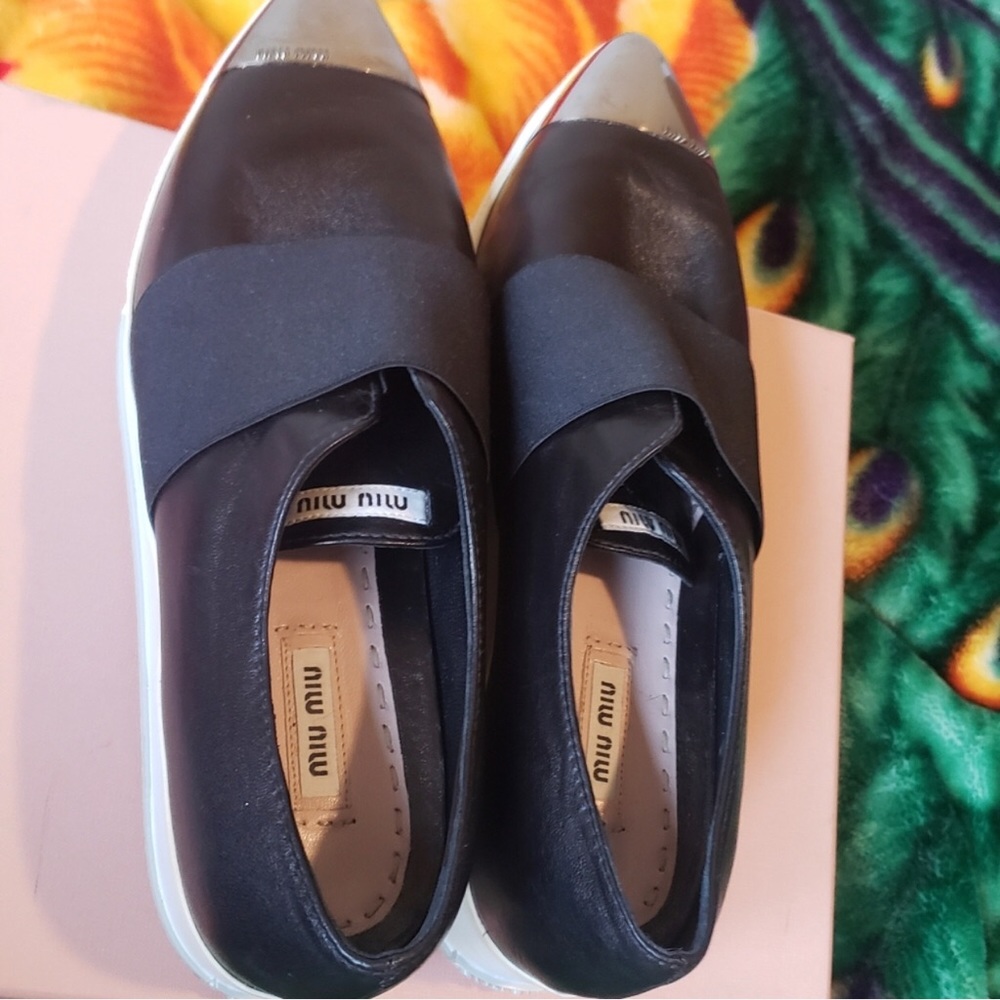 Miu Miu platform sneaker flats.